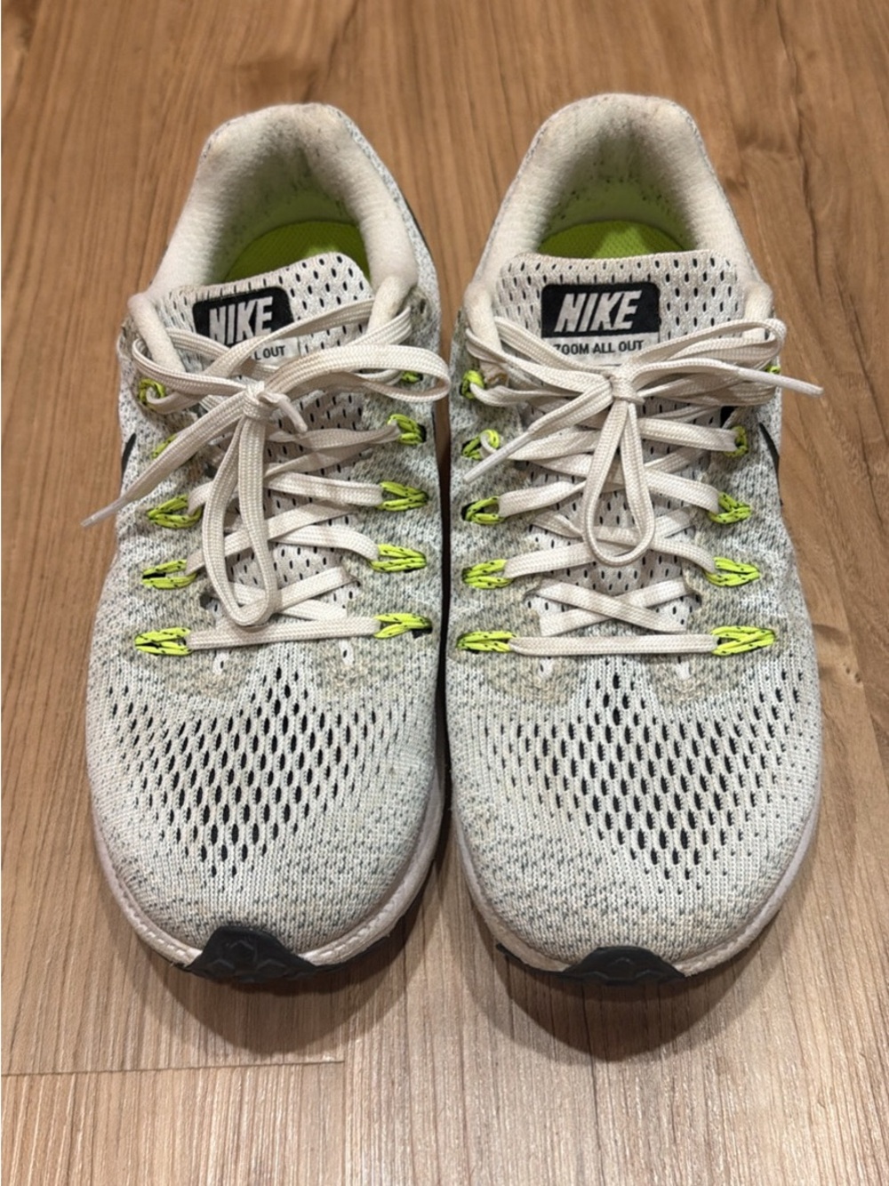 Nike White Flyknit Running Shoes with Neon Yellow Accents